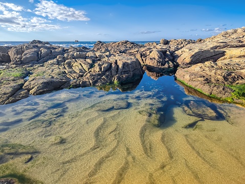 Corrubedo Cape and Lighthouse\nRegion of Barbanza, GALICIA, PROVINCE OF A CORUÑA, RIBEIRA / Capes, Lighthouses\nThe westernmost point of the Barbanza Peninsula is Cabo Corrubedo. It is located very close to the dunes of the same name and is characterized by being a rocky area with low scrub and small cliffs, although extremely harsh in terms of the forces of the sea, due to its latitude above the ocean, since this This point is one of the westernmost in the Rías Baixas.