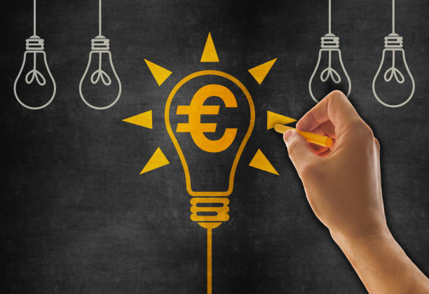 istock Hand Drawing Finance Ideas Concept with Light Bulb on Blackboard 1491959455
