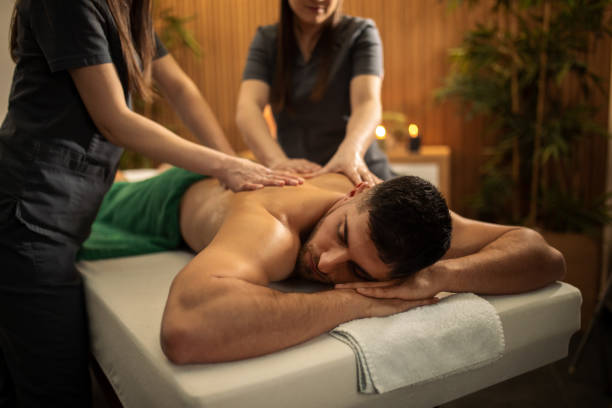 istock Young man receiving shoulder and back massage in spa center 1491966037