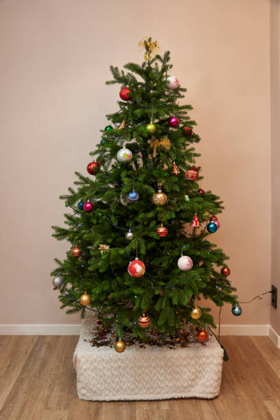 istock small Christmas tree decorated with Christmas toys 1491970514