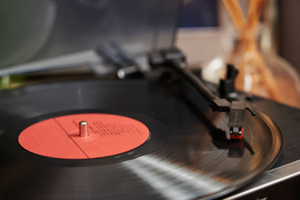 istock black record on a vinyl player. the record player is playing, the head with the needle is lowered onto the record 1491970812