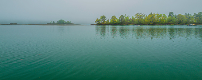 A misty and moody morning at Derwent Water in the English Lake District , Keswick, Cumbria, UK.