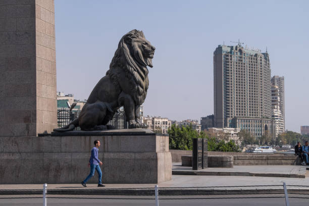 Cairo, Egypt - April 30, 2023: Kasr al-Nile bridge and lion statue with city view
