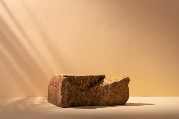 istock Stone podium for packaging presentation and cosmetic with shadow on wall 1491987056