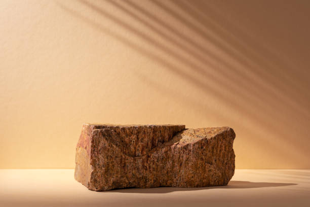 istock Stone podium for packaging presentation and cosmetic with shadow on wall 1491987119