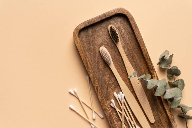 istock Eco-friendly bamboo toothbrushes, cotton buds and eucalyptus leaf 1491989137
