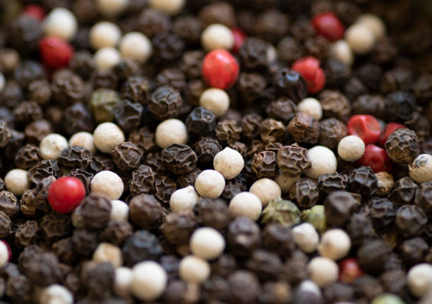 Close up of multicolored heap hot dried peppercorns.