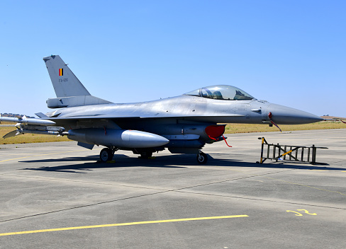 A modern American military aircraft, with missiles, takes off in a tactical operation, on the runway. High quality photo