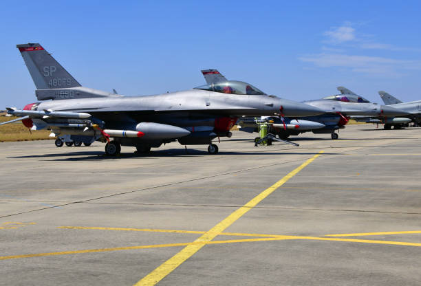 USAF F-16 Fighting Falcons (F-16CJ, the air defenses suppression version), Beja Airport, Portugal Beja, Portugal: parked General Dynamics F-16CJ Fighting Falcons of the United States Air Force 480th Fighter Squadron 'Warhawks', 52nd Fighter Wing, based in Spangdahlem Air Base, Germany configured for Suppression of Enemy Air Defences - 4th generation multi-role fighter - weapons under the wing: AIM-120 AMRAAM, middle AIM-9 Sidewinder, right AGM-88 HARM - Beja Airport serves both civil and military aviation. sidewinder missile stock pictures, royalty-free photos & images