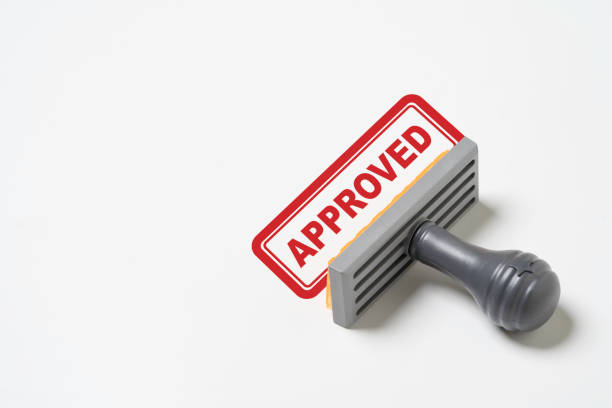 Isolate of Red text approved wording with rubber stamper on white background for document and project pass consider and quality control ISO concept.