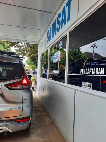 Purwokerto, Jawa Tengah, Indonesia-March 2023: Fast Samsat (one-stop administrative system) or drive thru samsat, providing Motorized Vehicle Registration and Identification services, payment of taxes on motorized vehicles