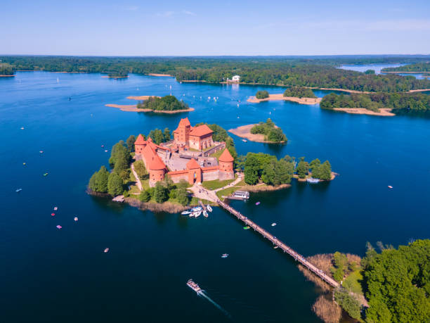 Trakai, Lithuania - July 22, 2018: Yacht boats and Trakai Island Castle in lake Galve in day, Lithuania. Trakai Castle is one of major tourist attractions of Lithuania