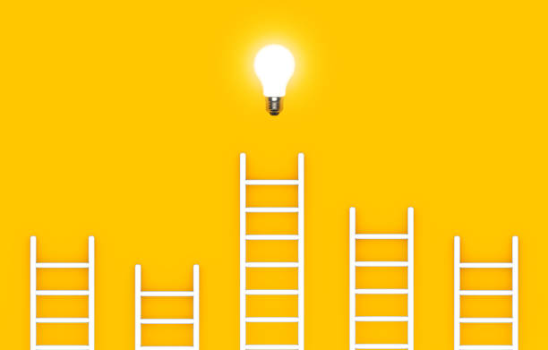 istock Ladder reaches up to a lit light bulb representing an Idea, creativity, invention concept. 1492008455