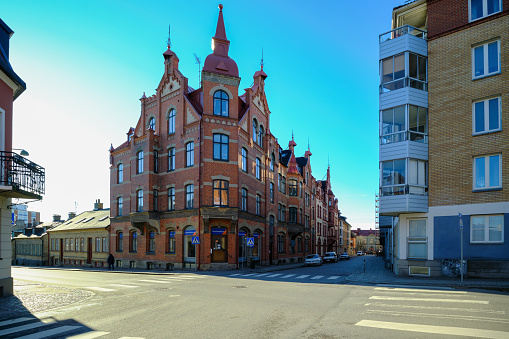 Street with Typical Old Buildings and new residential buildings in Lund, Sweden