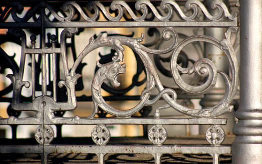 Full frame view of ancient bandstand cast iron decorated railing at dusk. Image suitable for background purposes.Mondoñedo, Lugo province, Galicia, Spain.