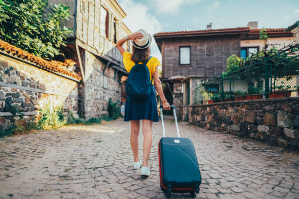 Tourist woman traveling around Europe stock photo