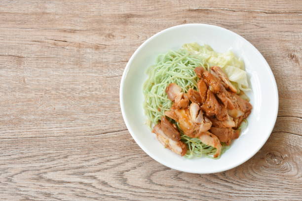 istock jade Chinese egg noodles topping Korean fried slice chicken with cabbage dressing sauce 1492018797
