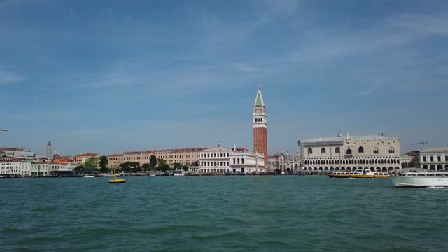 View from the window of the catamaran on the Venetian lagoon, the architecture of Venice, including Doge's Palace, St Mark's Basilica and St. Mark's Campanile, Italy.