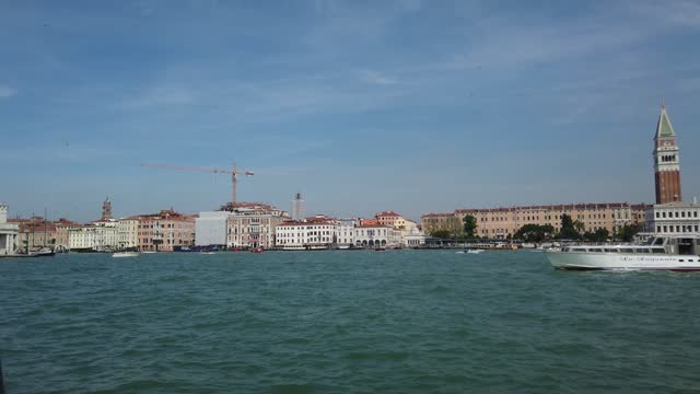 View from the window of the catamaran on the Venetian lagoon, the architecture of Venice, including Doge's Palace, St Mark's Basilica and St. Mark's Campanile, Italy.