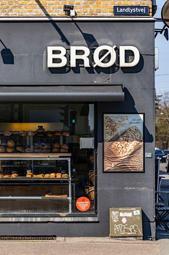 Copenhagen, Denmark April 20, 2023 The front window of a local bakery in the Brondby suburb and sign in Danish says: Bread