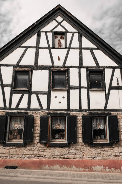 April, 26 2023. Gau-Weinheim, Alzey-Worms district, Rhineland-Palatinate. Traditional half-timbered house. Brown and white color.