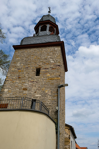 Gau-Weinheim leaning tower. Inclination angle 5,4 degrees. Medieval defense tower. Alzey-Worms district in Rhineland-Palatinate. Copy space.