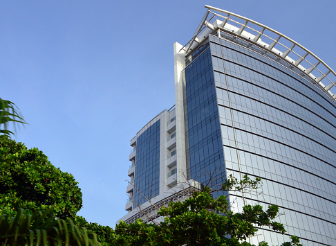 Lagos, Nigeria: the glass-clad Nestoil Tower, Akin Adesola Street, Victoria Island - service provider in the Nigerian Oil and Gas industry, the largest indigenous Oil & Gas Engineering and Services (EPCC) service provider for major IOCs (Integrated oil companies, the Majors) in Sub-Saharan Africa - Obijackson Group. The building was designed by ACCL (Adeniyi Cocker Consultants Limited), constructed by Julius Berger PLC, completed in December 2015 and attained the LEED (Leadership in Energy and Environmental Design) standard Certification (Silver) rating.