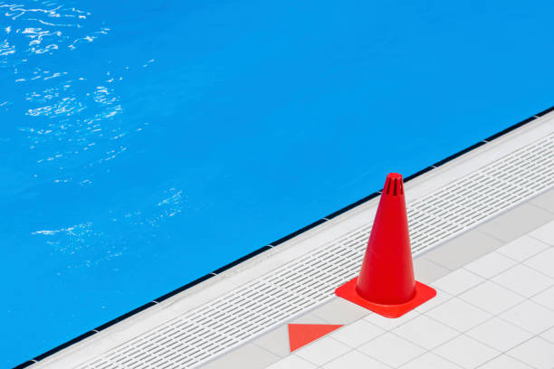 istock Red training cones on swimming pool floor. Trainning and camp concept. Horizontal sport theme poster, greeting cards, headers, website and app 1492028142