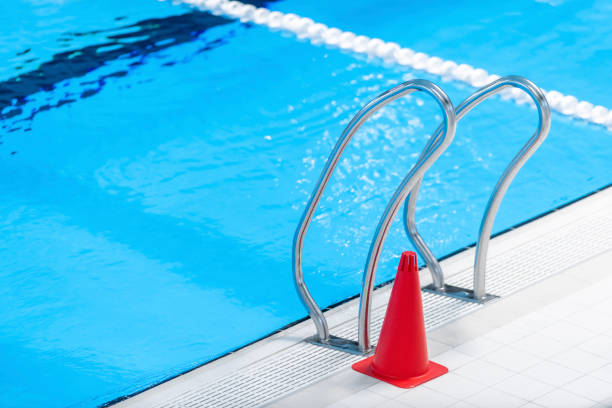 istock Red training cones on swimming pool floor. Trainning and camp concept. Horizontal sport theme poster, greeting cards, headers, website and app 1492028177