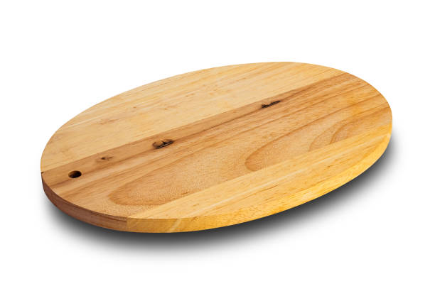 istock High angle view of brown wooden oval shape cutting board . 1492029159