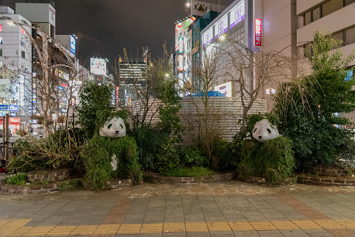 Panda statue covered in trees in the district of Ueno in Tokyo