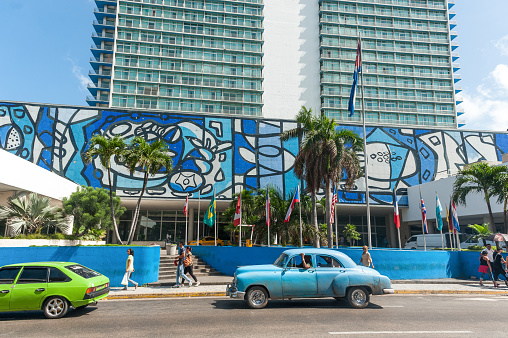 Havana, Cuba - October 23, 2017: Havana Cityscape with Old Car and Habana Libre Hotel