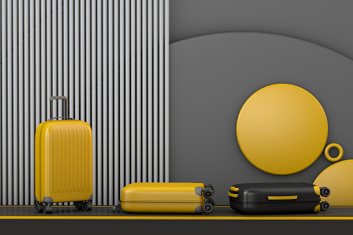 Business travel concept with luggage in baggage claim area at the airport