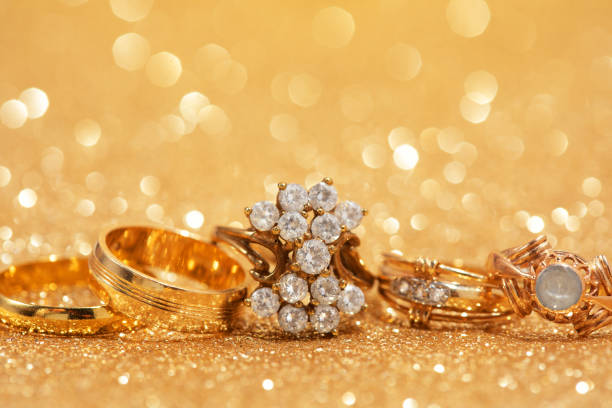 istock Gold rings on gold background. 1492032571