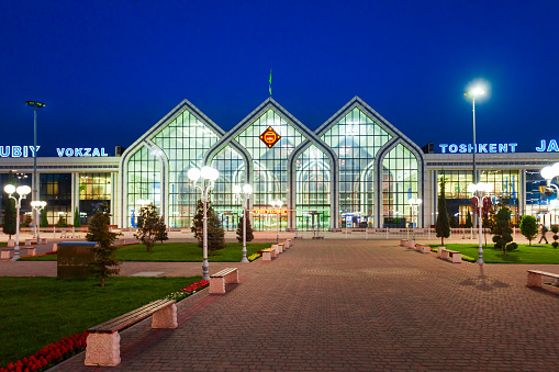 Tashkent, Uzbekistan - April 12, 2021: Yuzhny Vokzal is the main passenger railway station in Tashkent city, Uzbekistan at night
