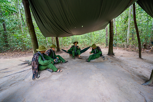Ho Chi Minh city, Vietnam - 20 May 2023: Soldiers sitting under a canopy. Installation of the American Vietnam war near Cu Chi tunnel, Ho Chi Minh city, Vietnam
