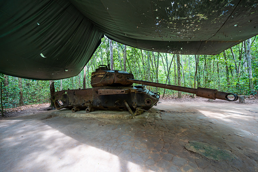 View of old American tank destroyed in Cu Chi, Vietnam in 1970. Cu Chi tunnel is now touristic destination in Ho Chi Minh city, Vietnam. Travel concept.