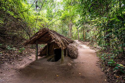 view of the guerrilla camp at Cu Chi tunnels were the location of several military campaigns during the Vietnam War, is now touristic destination. Travel concept.