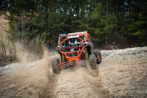 istock UTV, ATV off road driving in sandy open area. Buggy extreme riding 1492036522