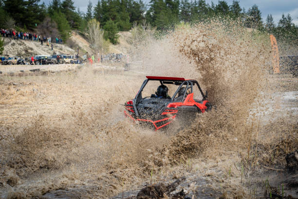istock ATV, UTV hard driving over the mud off road 1492036523
