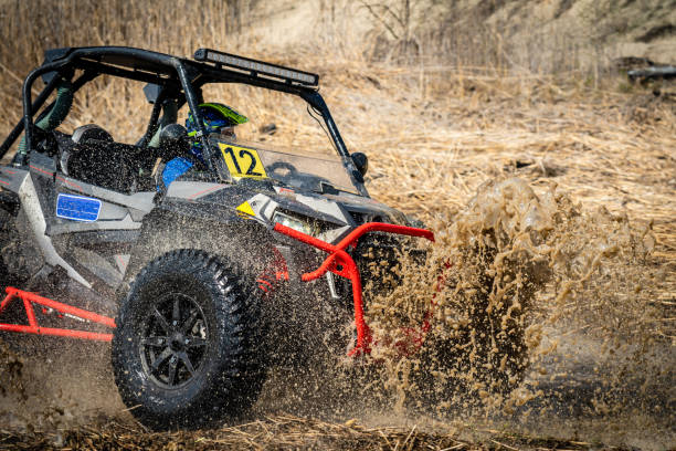 istock Active ATV and UTV Off-Road vehicle in muddy water. ATV 4x4 1492036525
