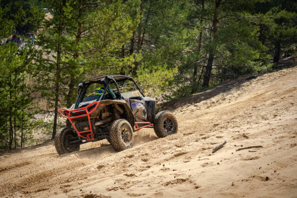 istock UTV, ATV, 4x4 off road vehicle in sandy open area. Buggy extreme riding 1492036530