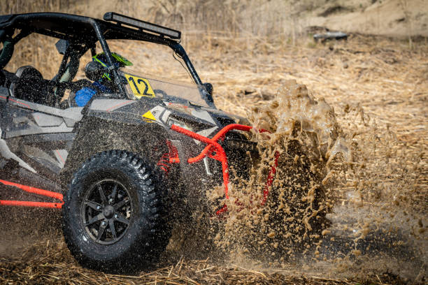 istock Active ATV and UTV Off-Road vehicle in muddy water. ATV 4x4 1492036536