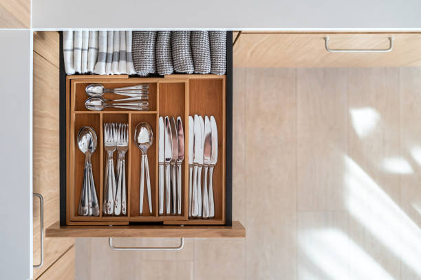 istock Opened kitchen drawer with wooden box for cutlery 1492038580