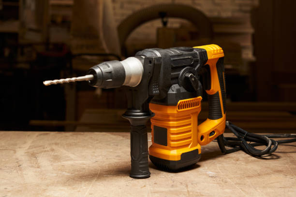 istock a beautiful black and yellow network puncher with a drill and an additional handle stands on a wooden workbench in the workshop 1492045696