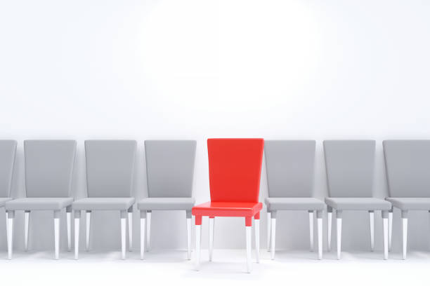 istock One red chair between white chairs. A row of chairs on a white background. 1492049764