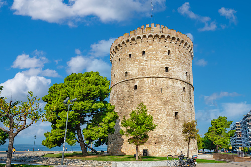 View to historical White Tower on the sea promenade in Thessaloniki. Greece