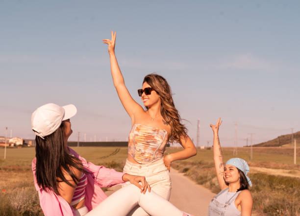 The three beautiful friends enjoy their summer vacation trip.