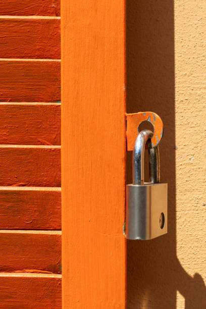 istock Padlock on wooden door. 1492053378