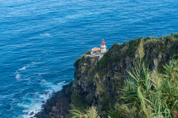 istock Lighthouse on a rocky coast, Ponta do Arnel, Azores, 1492058821